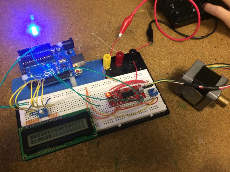 Initial testing of components — Arduino Uno, display, potentiometers, and stepper motor.