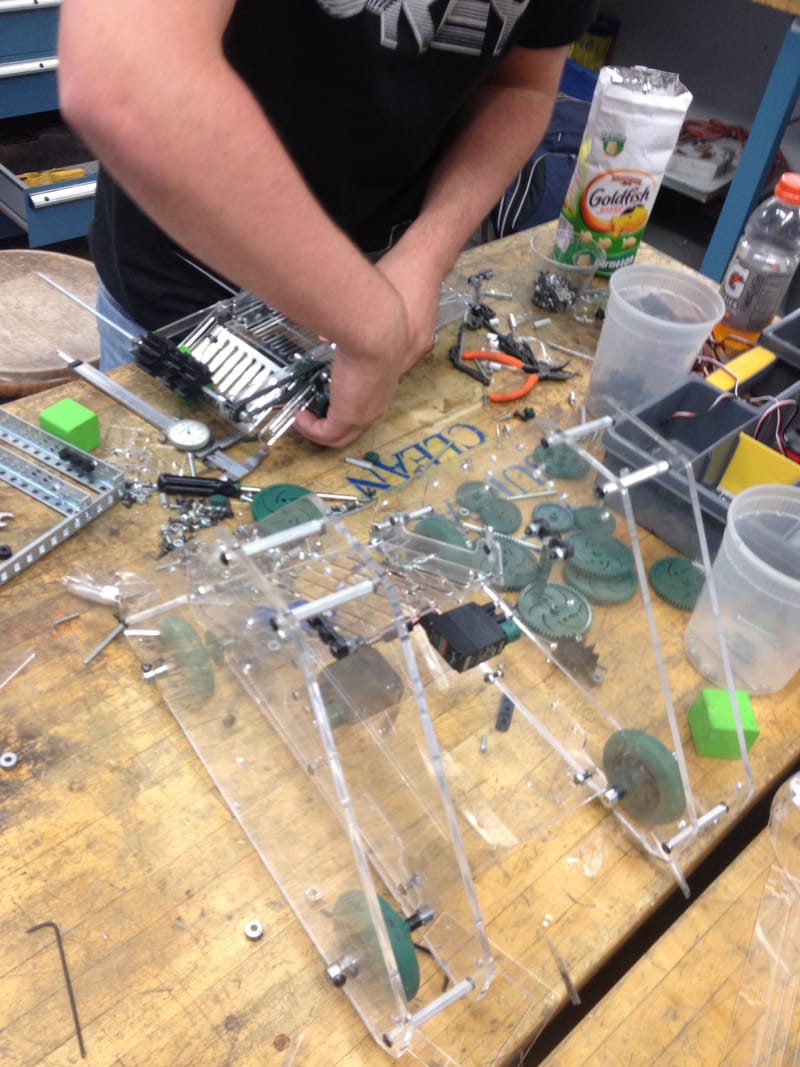 Mid-construction — four A-frames with wheels protected between them.