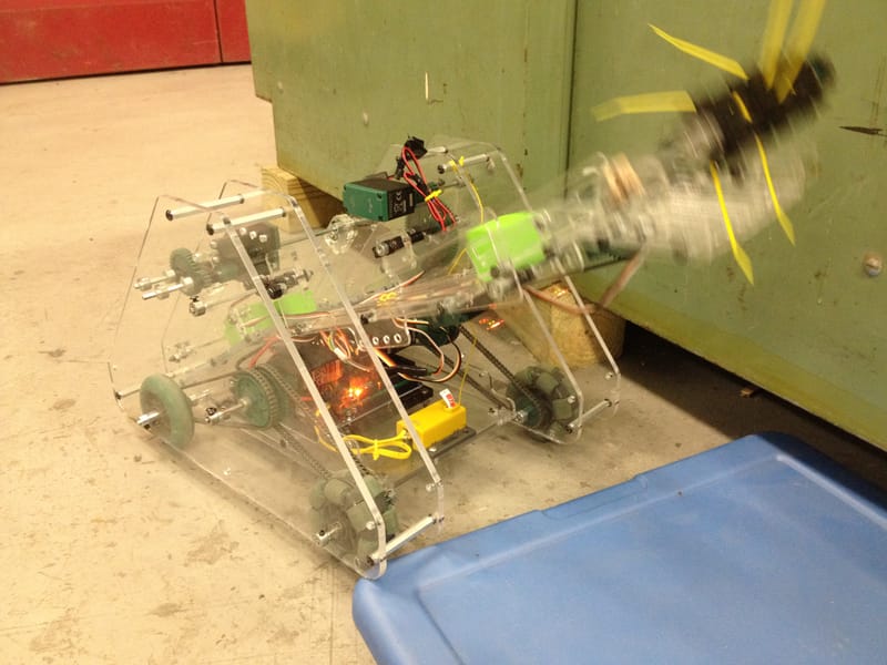 The "shoulder" lifting blocks into the rear trunk.