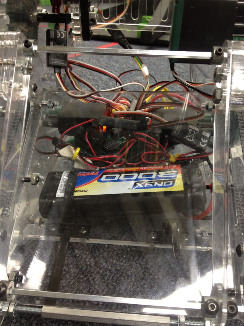 Electronics stored low in the A-frame — weight centered to prevent tipping.