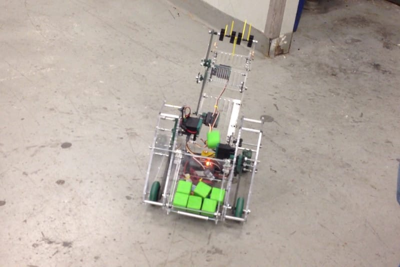 Rear storage holding 12–16 blocks per trip.